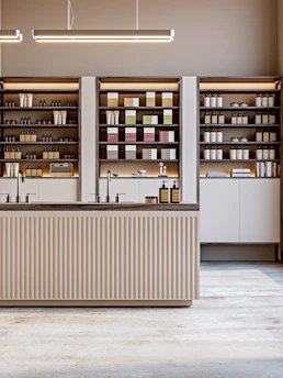 A minimalist shop with shelves and products.