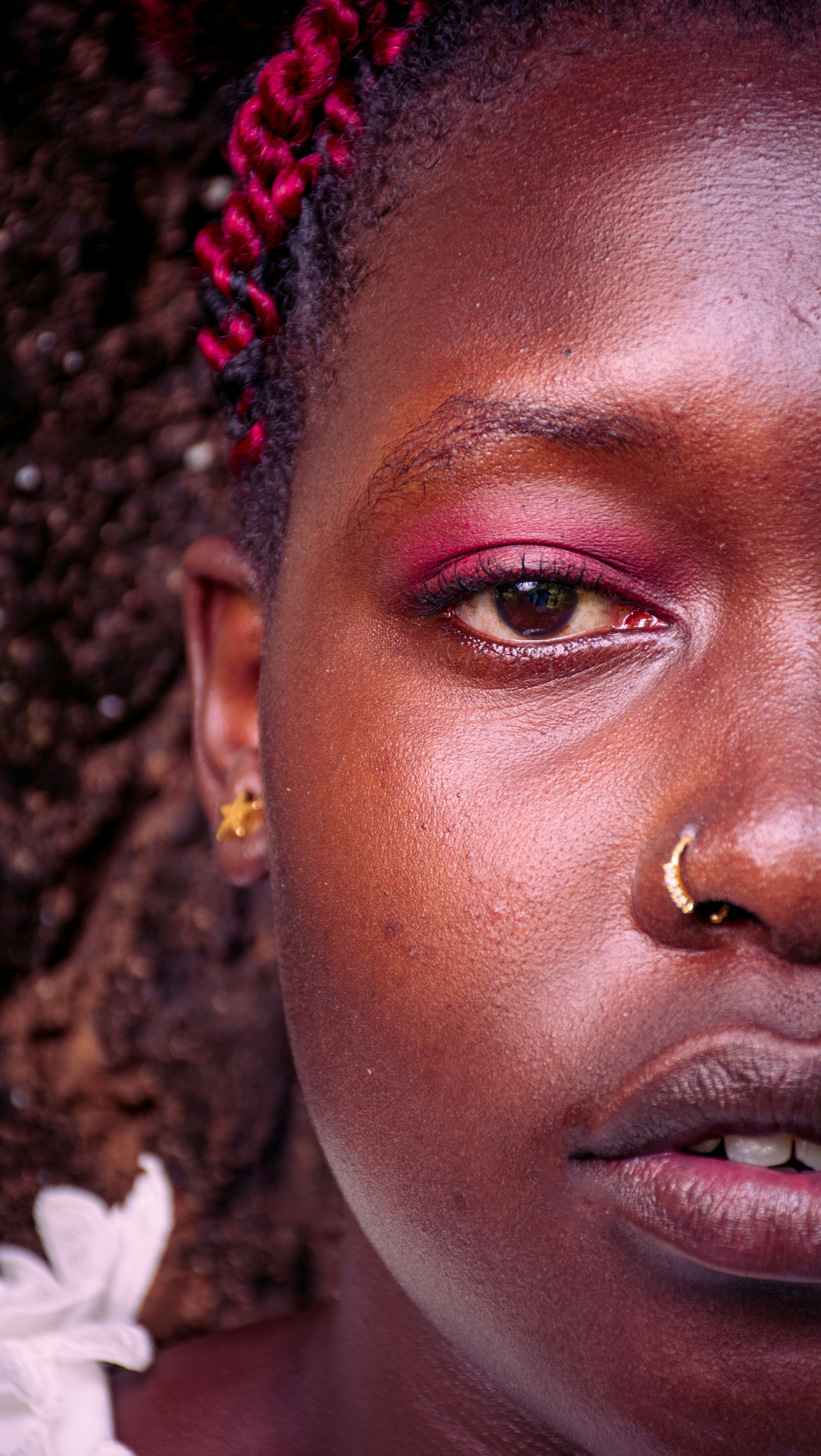 A portrait of a woman's face with makeup.
