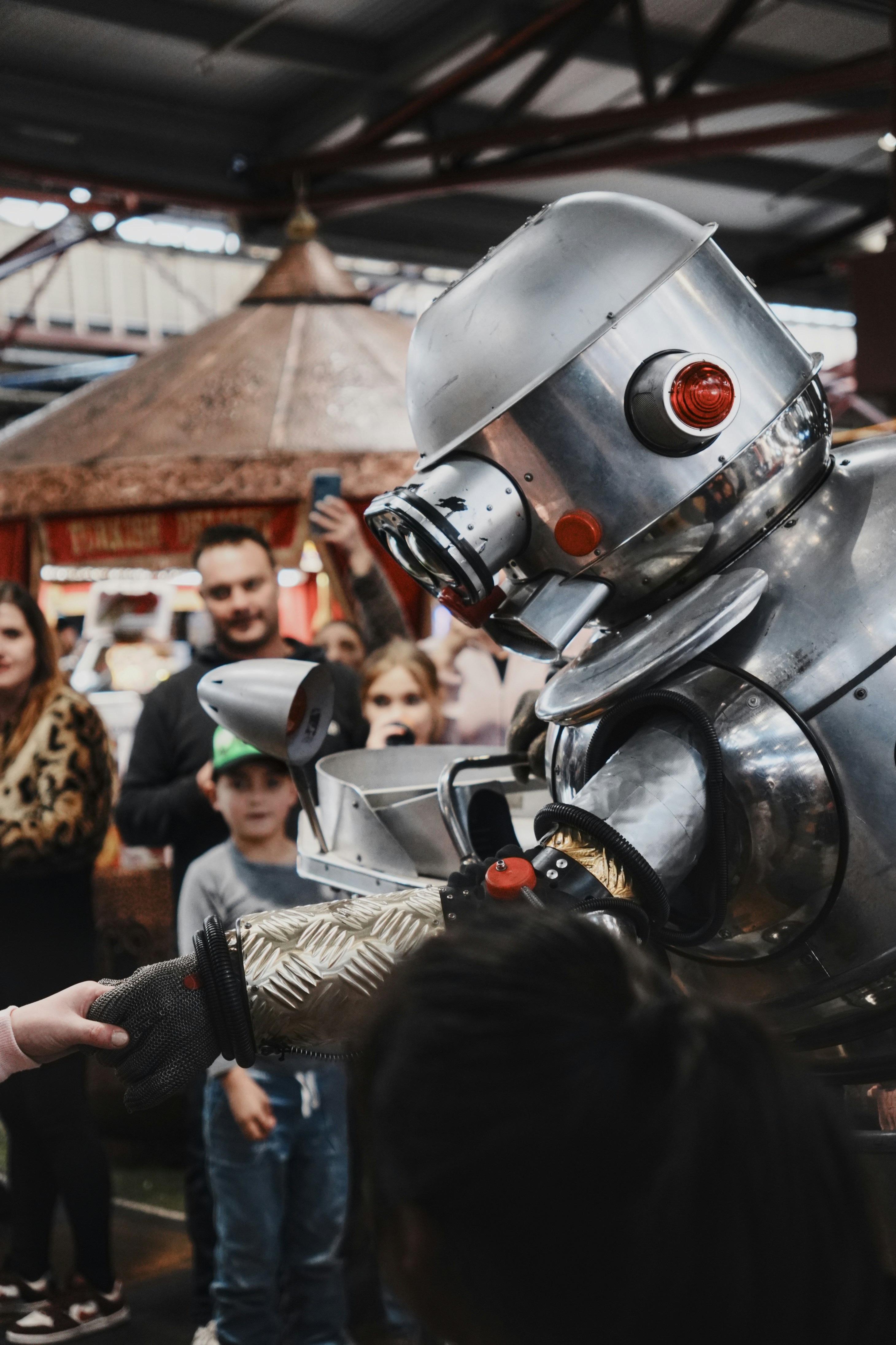 Robot interacts with people at an event.