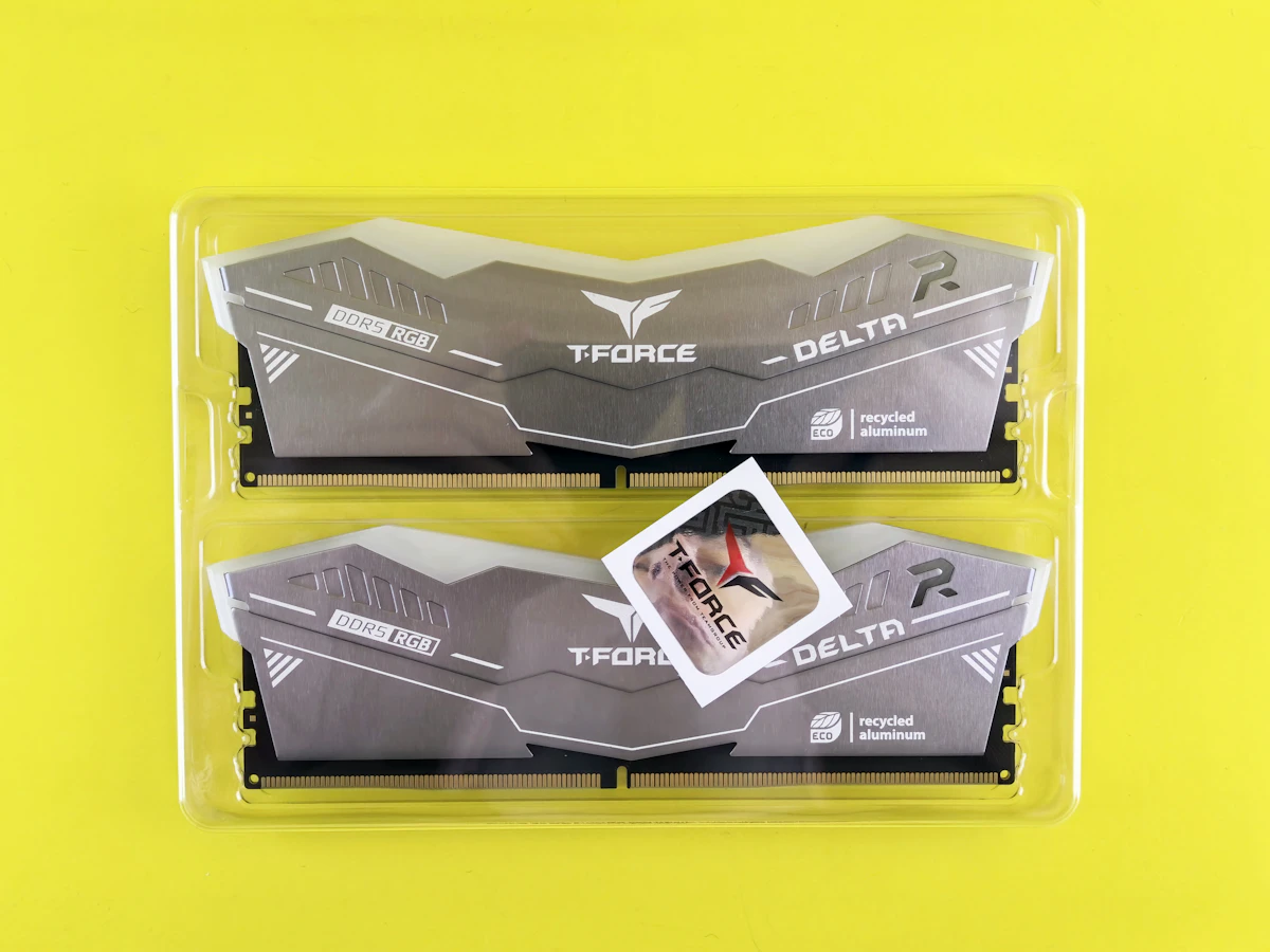 Two DDR memory modules in a plastic tray, illustrating the DRAM components at the centre of the 2026 memory shortage