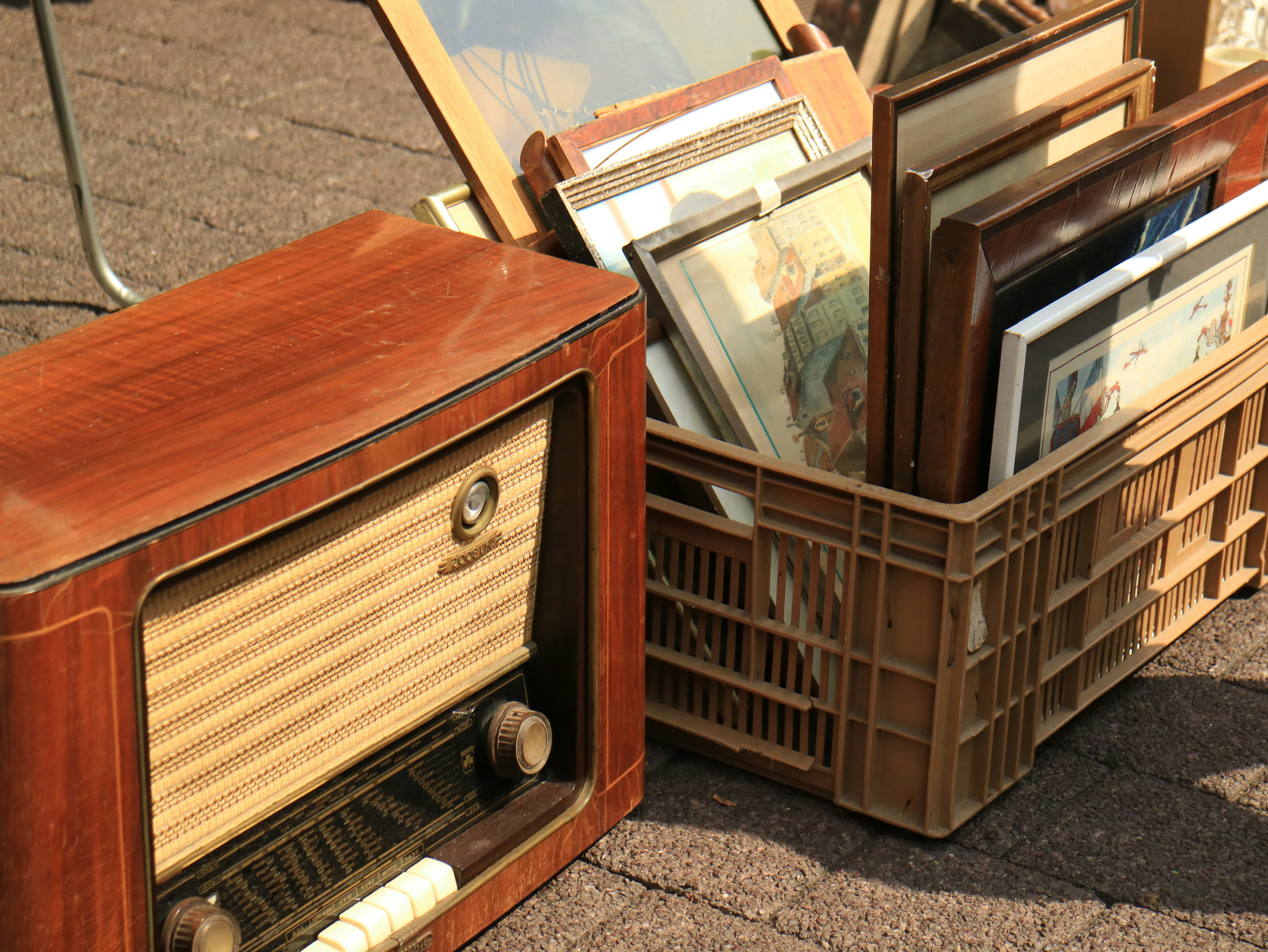 Vintage radio and antique art for sale.