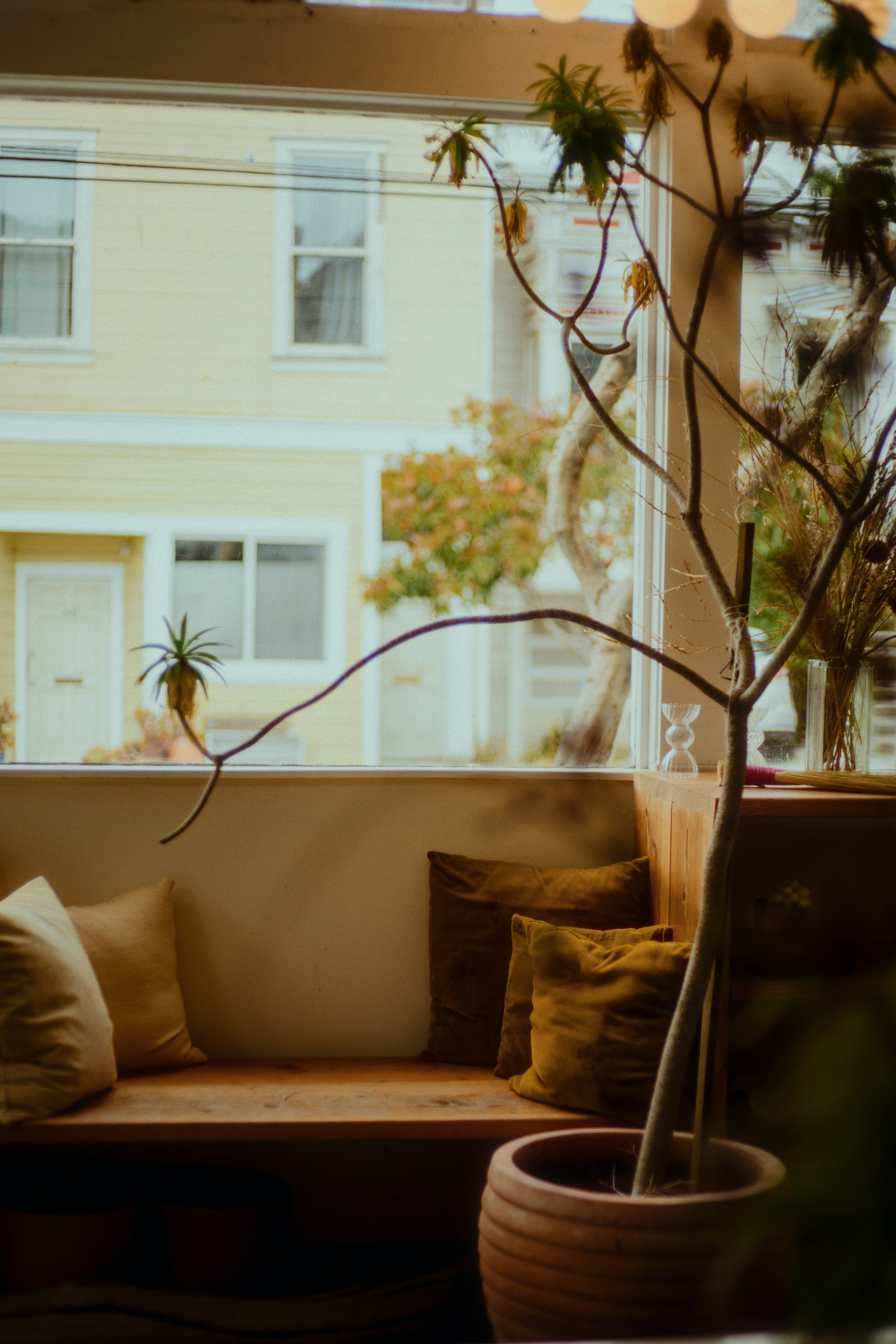 A cozy indoor seat with a window view.