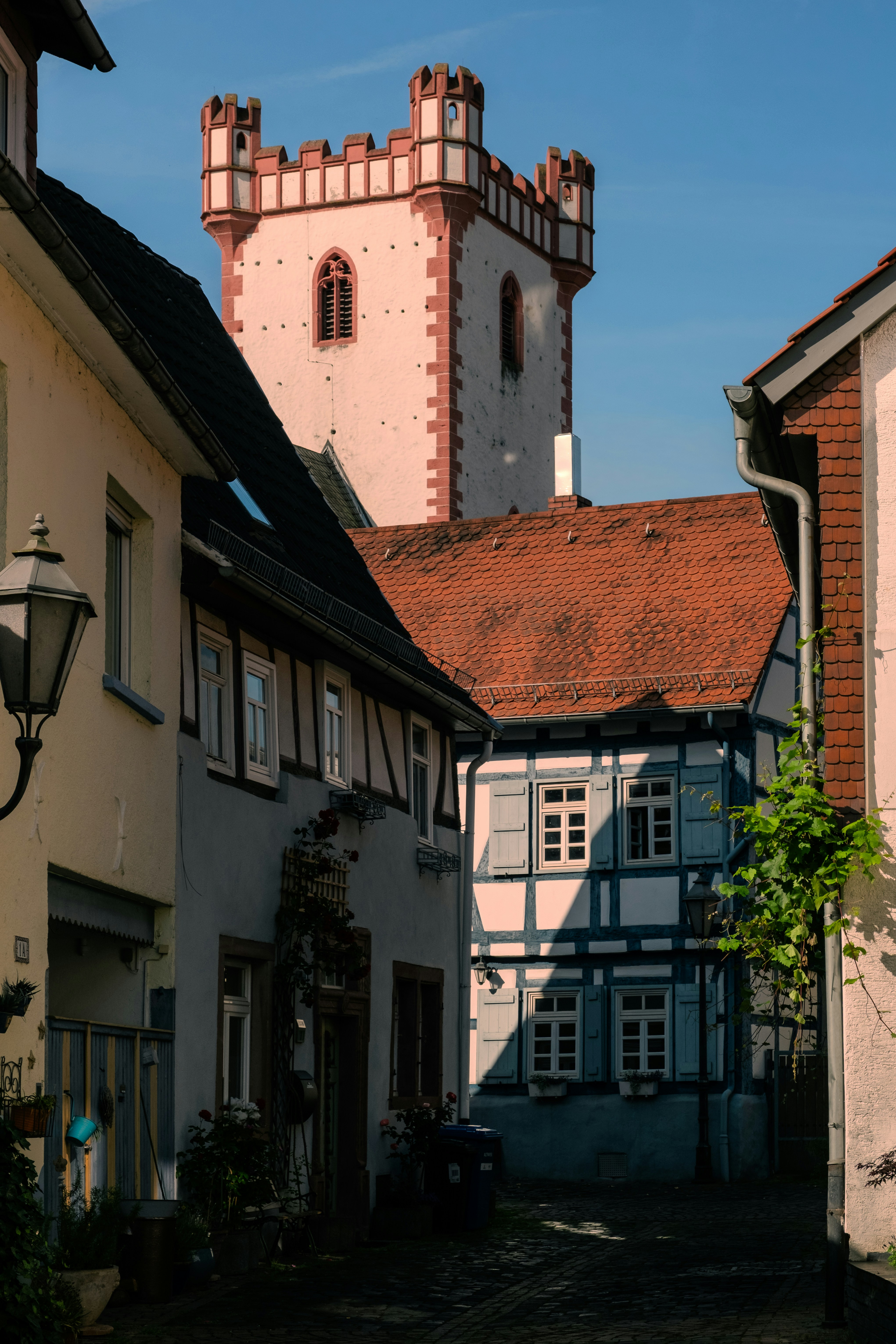 Buildings and a tower in a sunny, european town.