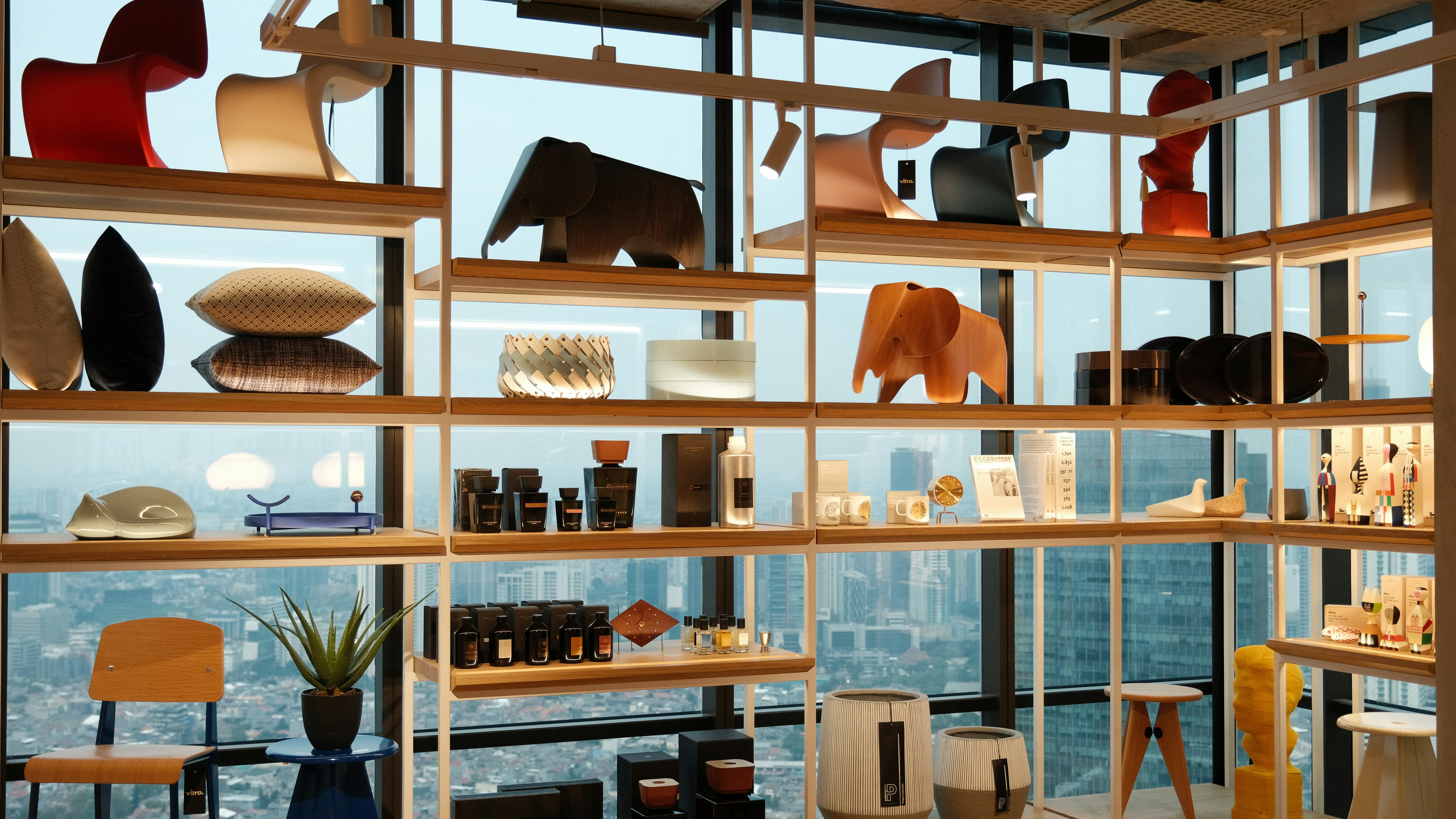 Modern home decor showroom display featuring furniture and accessories.