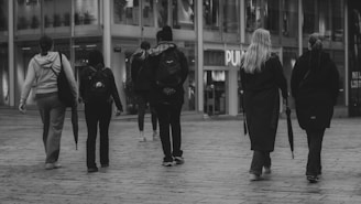 People walk on a city street.