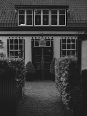 An old building's  front entrance. This building has specialist buyer demand.