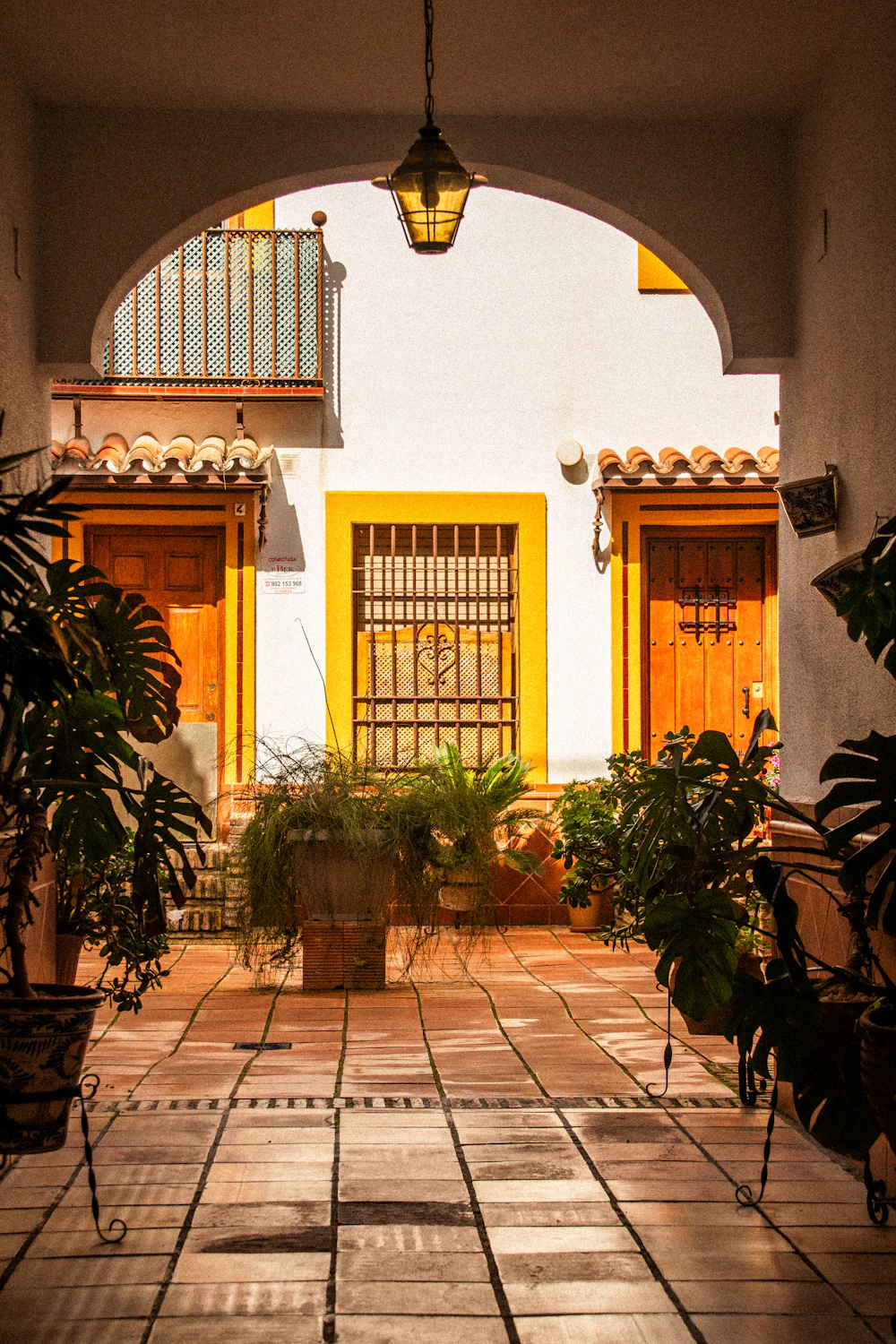 Private courtyard entry through an archway