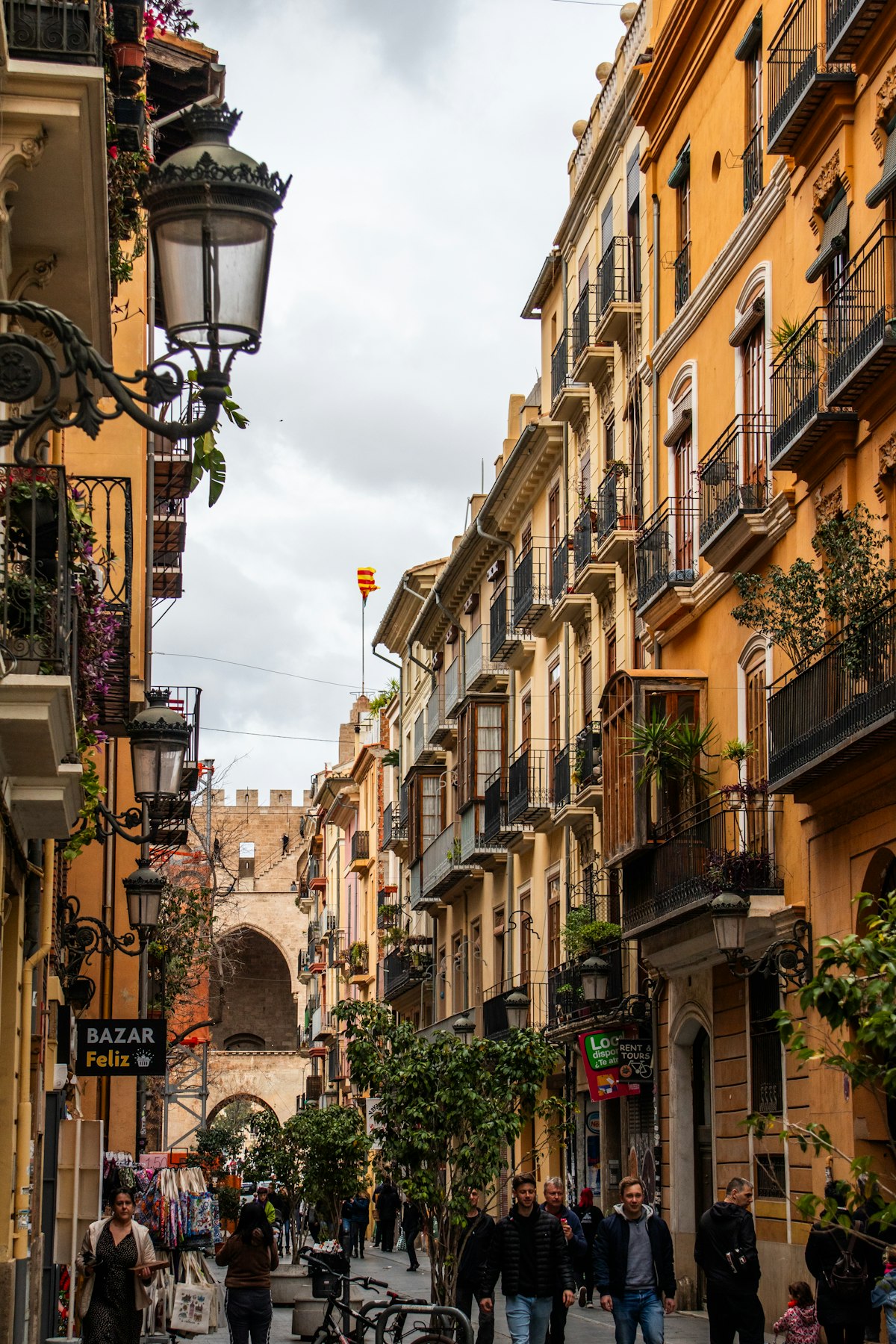 Vibrant narrow street in Valencia old town with colorful buildings and local nightlife atmosphere