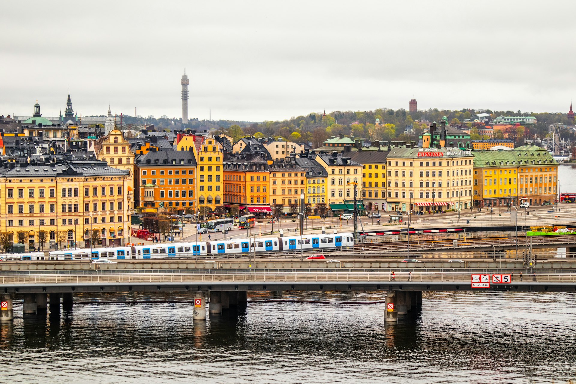 Colorful waterfront buildings and church spires across the Stockholm skyline in summer