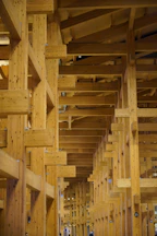 Wooden beams create a geometric architectural interior.