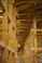 Wooden beams create a geometric architectural interior.