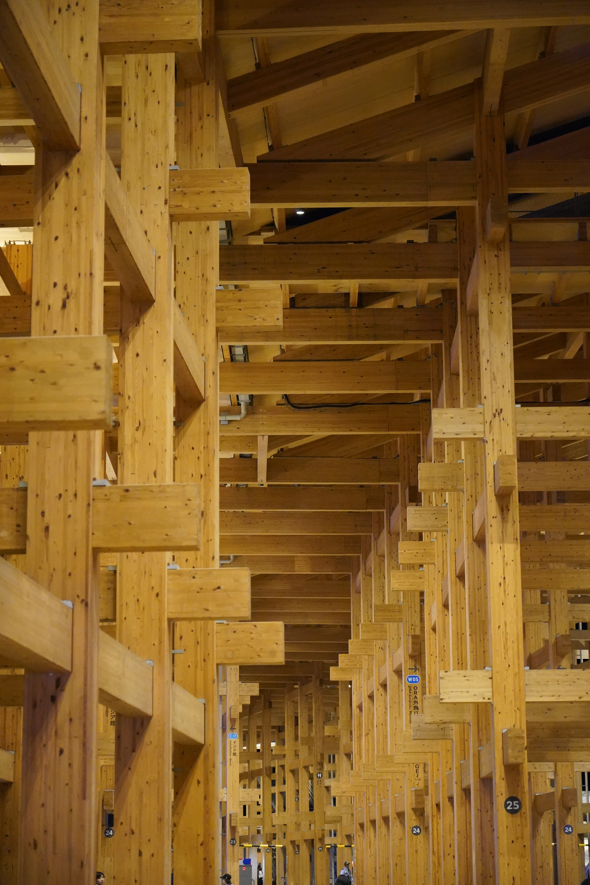 Wooden beams create a geometric architectural interior.