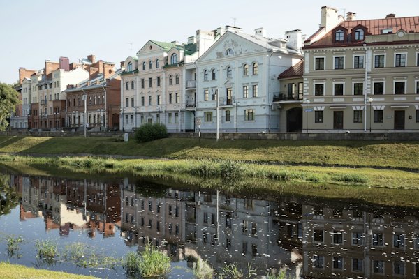 Old houses reflected in the river — Pskov, Russia