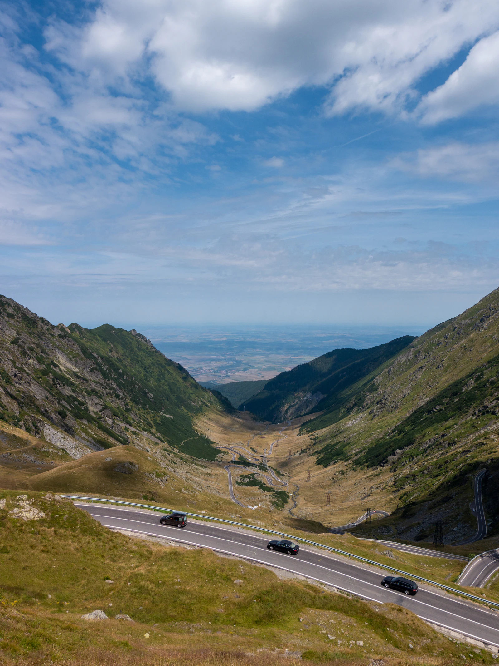 Cars travelling through the high Făgăraș Mountains