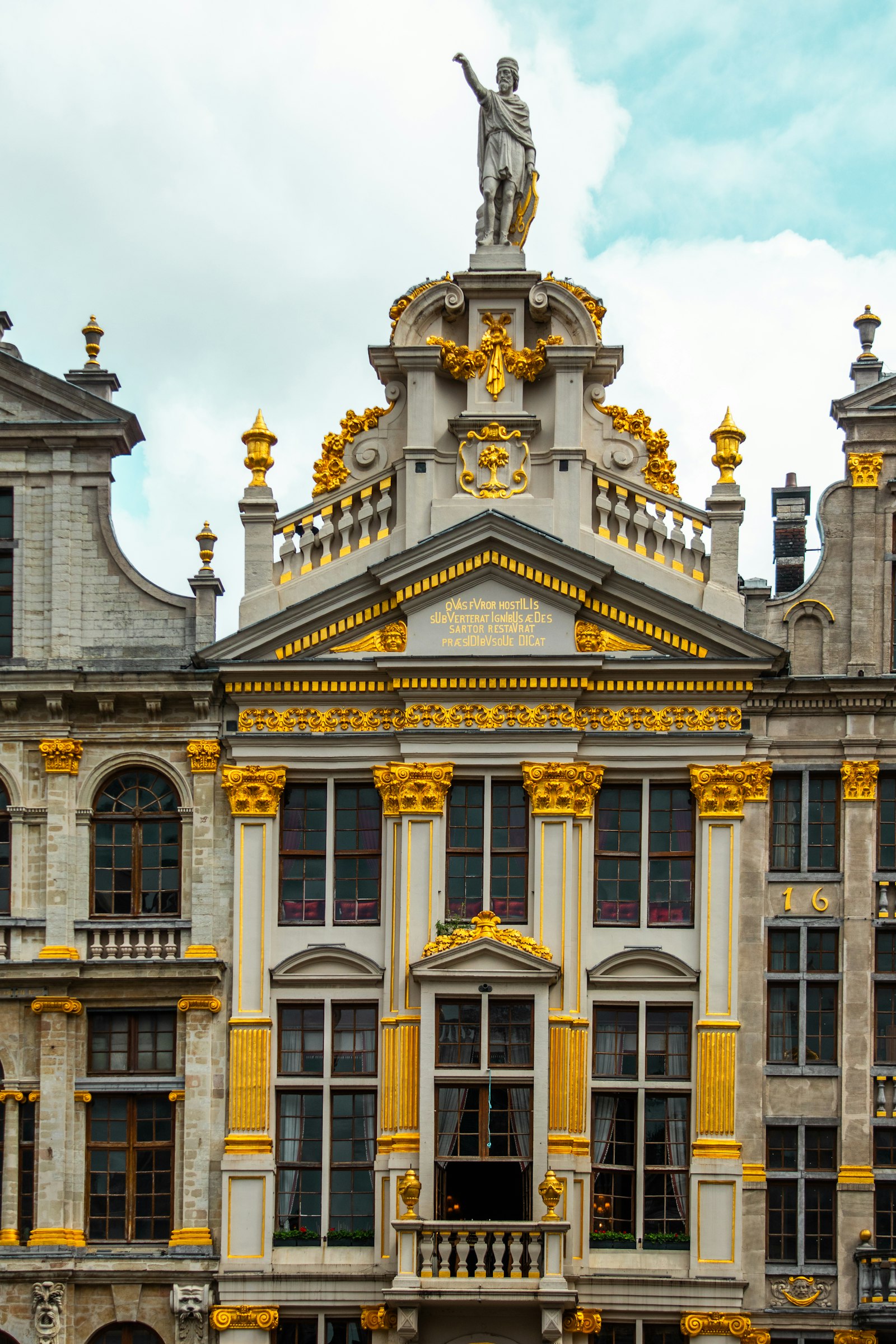 Ornate Art Nouveau building facade with golden accents and sculpted details