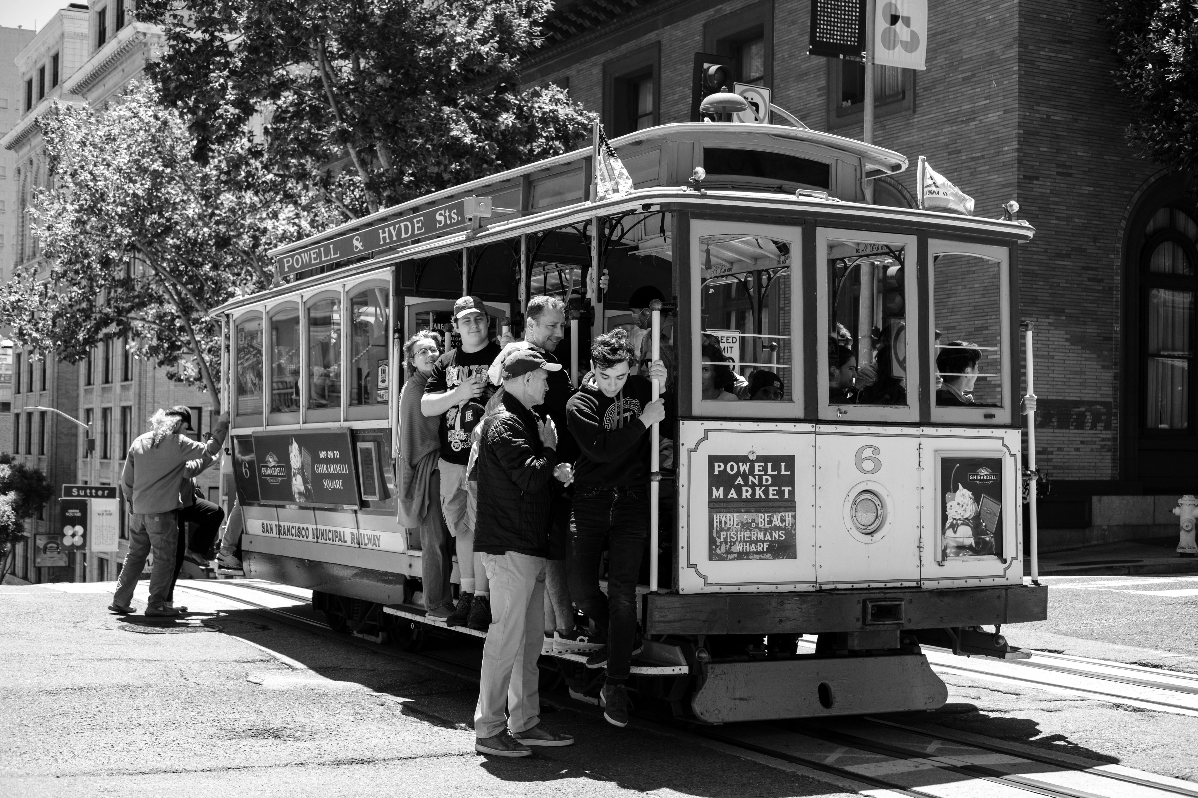 A san francisco cable car transports passengers.