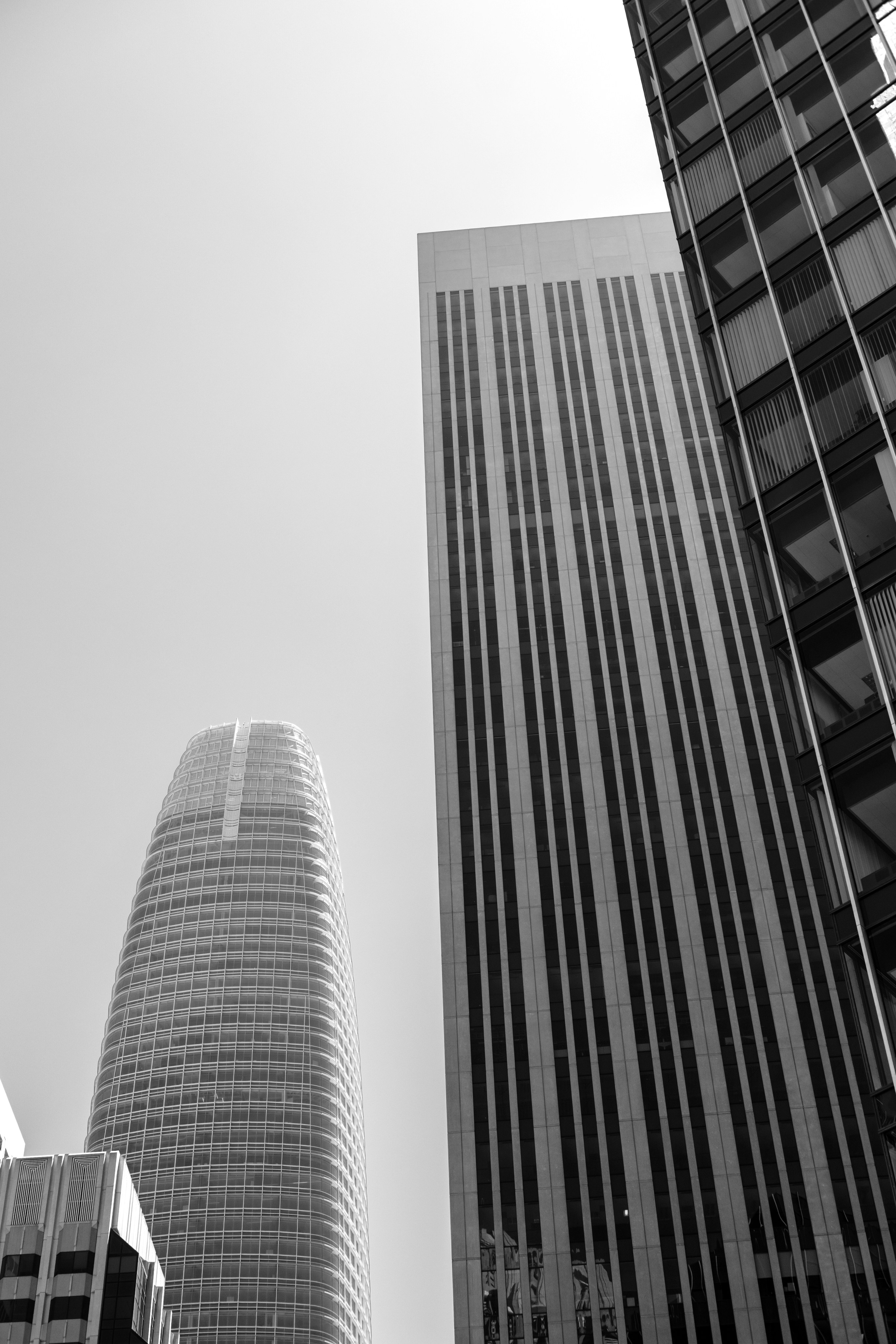 Skyscrapers tower against the cloudless sky.