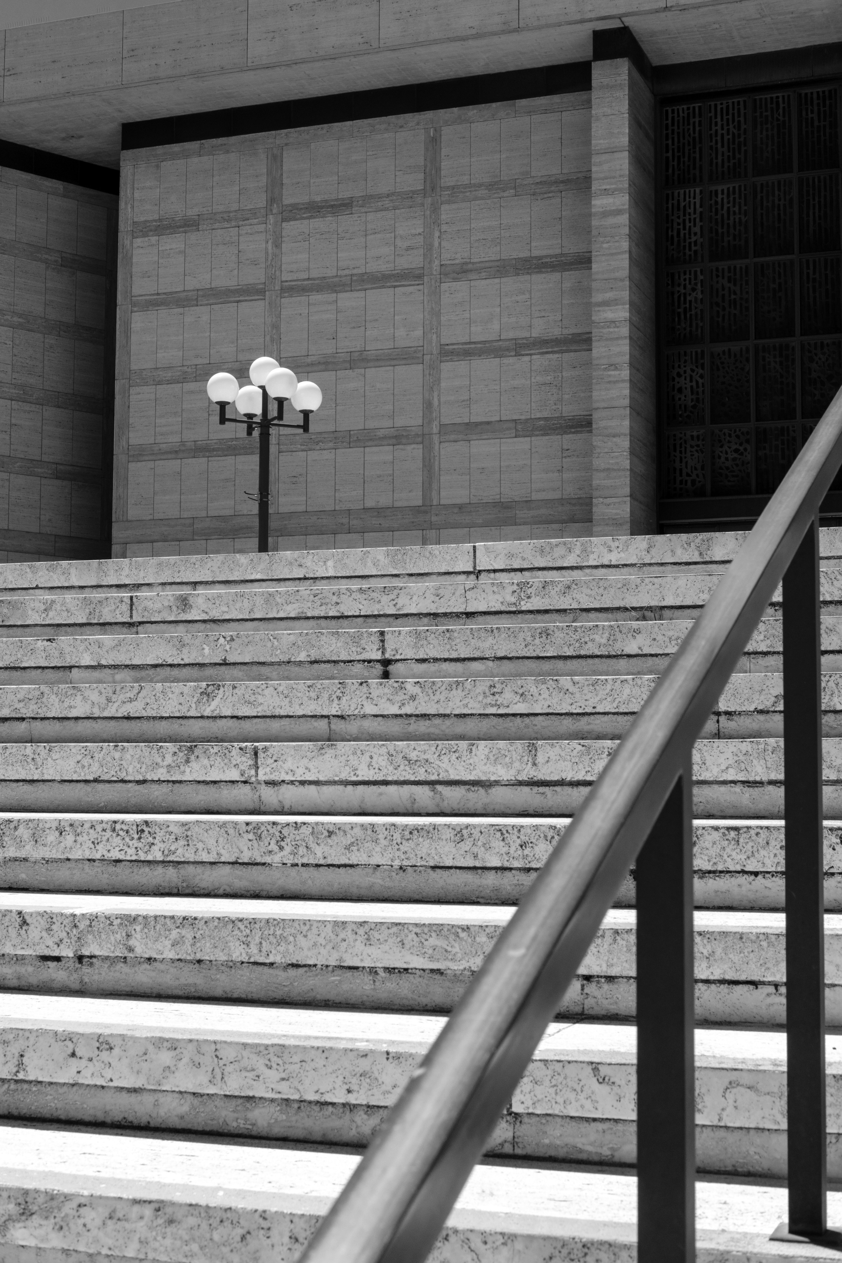 Stairs leading up to a building with a light.