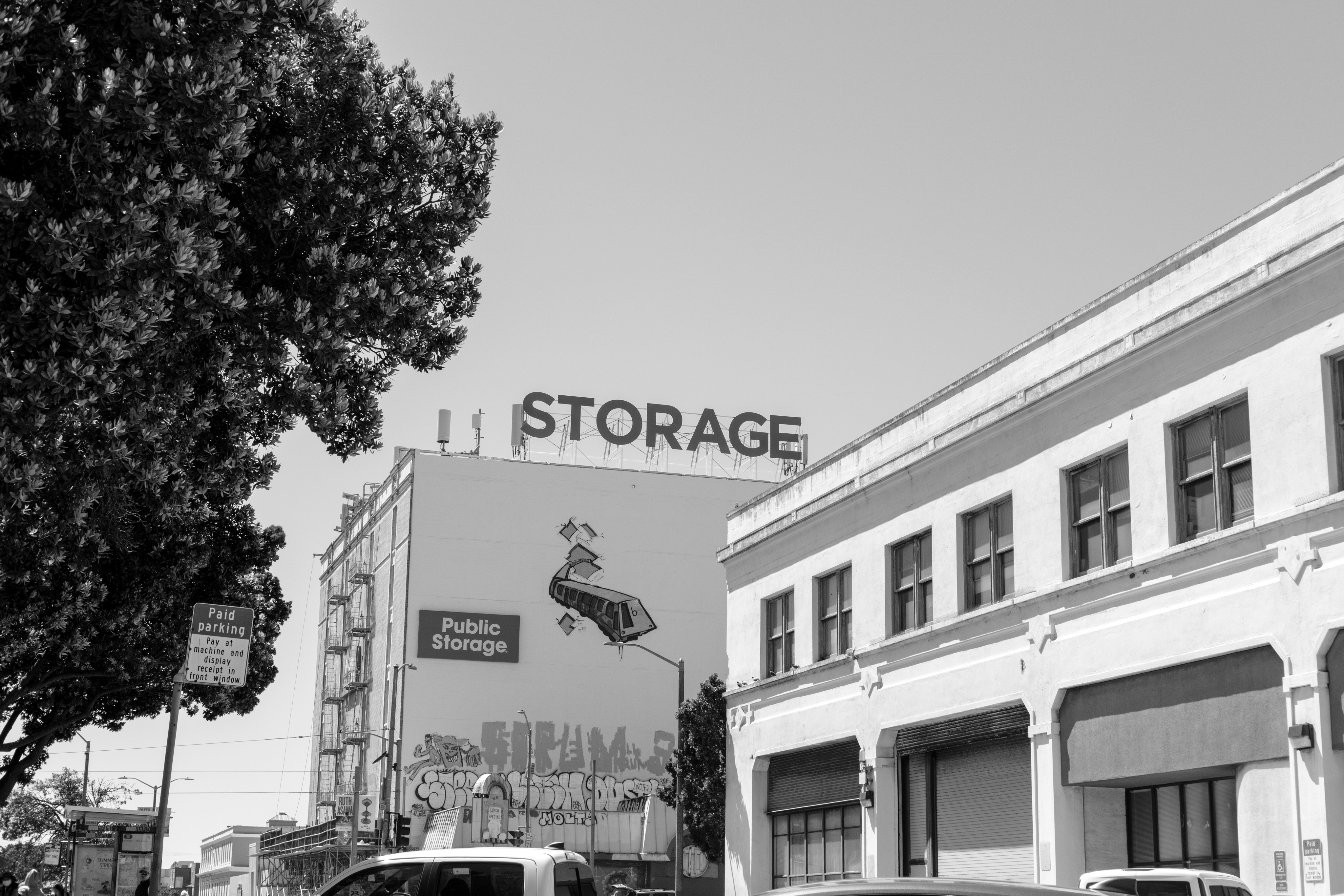 Buildings with "storage" sign in a cityscape.