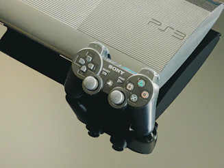 A playstation 3 console and its controller