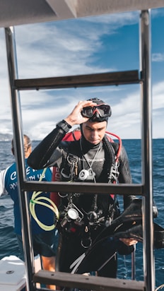 A scuba diver prepares for a dive.