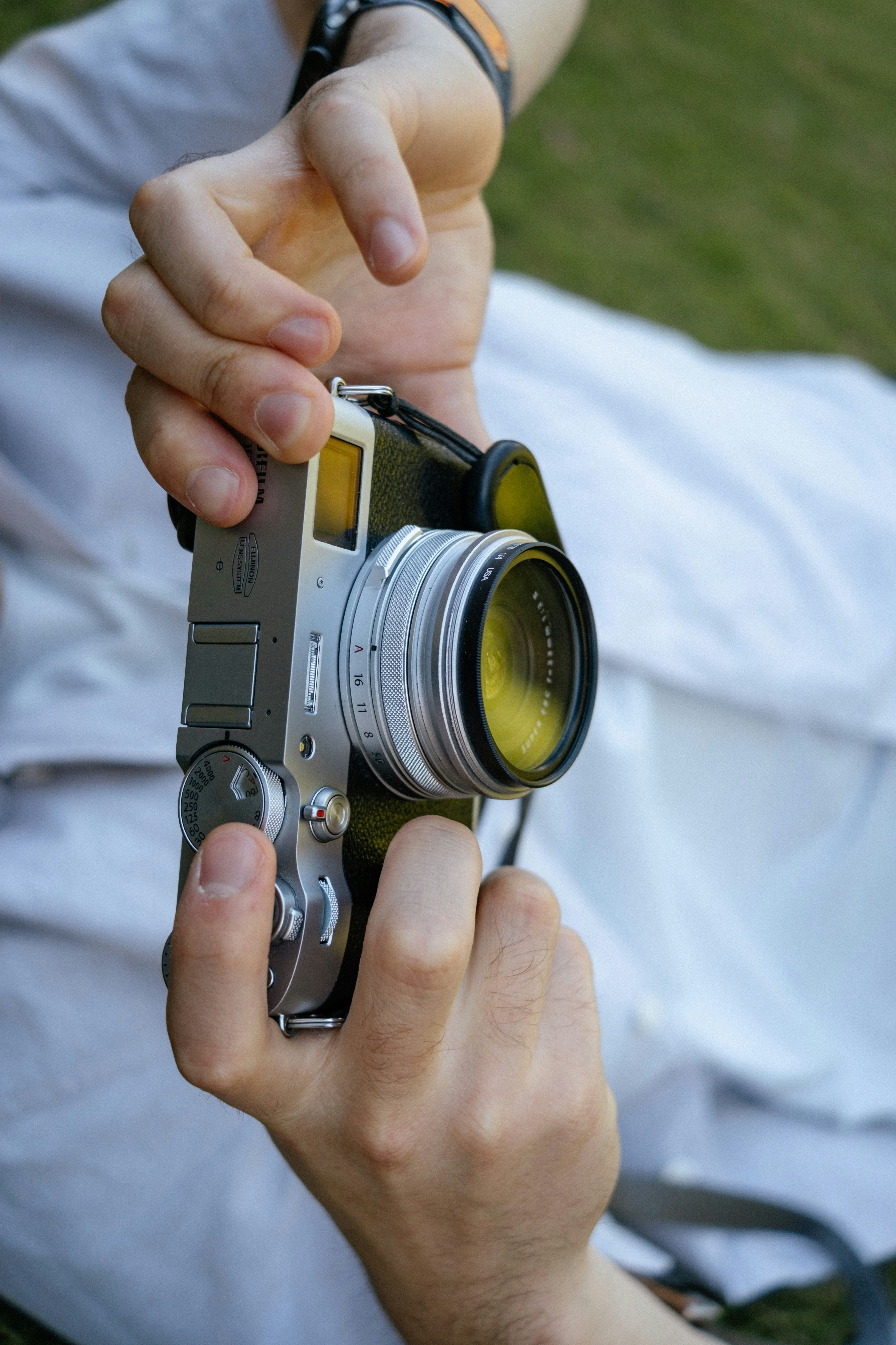 A person holds a vintage camera.