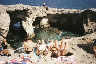 People relax and swim in a grotto.