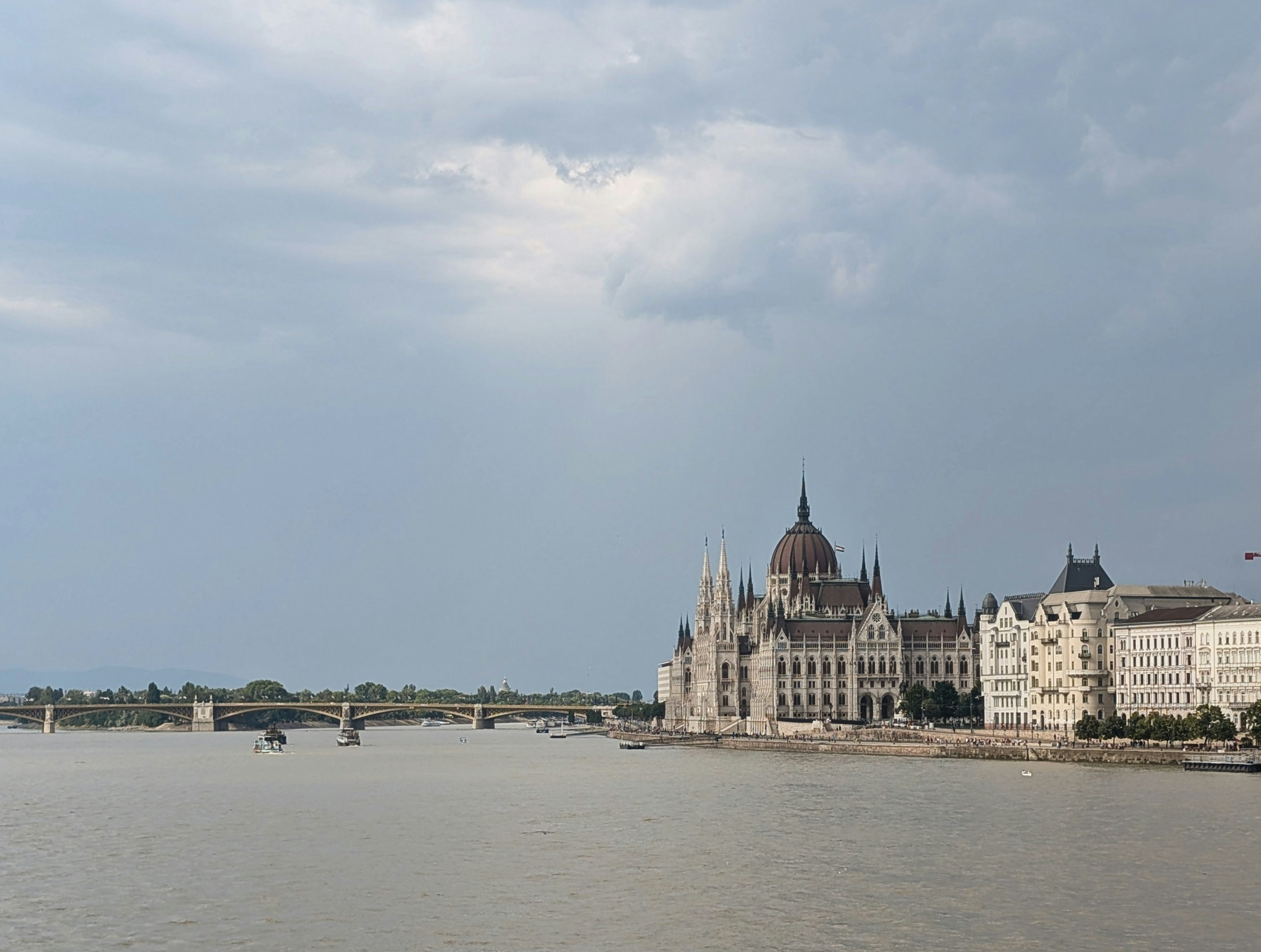 The hungarian parliament building stands beside the danube.
