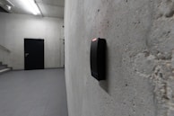 A card reader and a dark door are visible.
