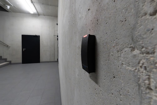 A card reader and a dark door are visible.