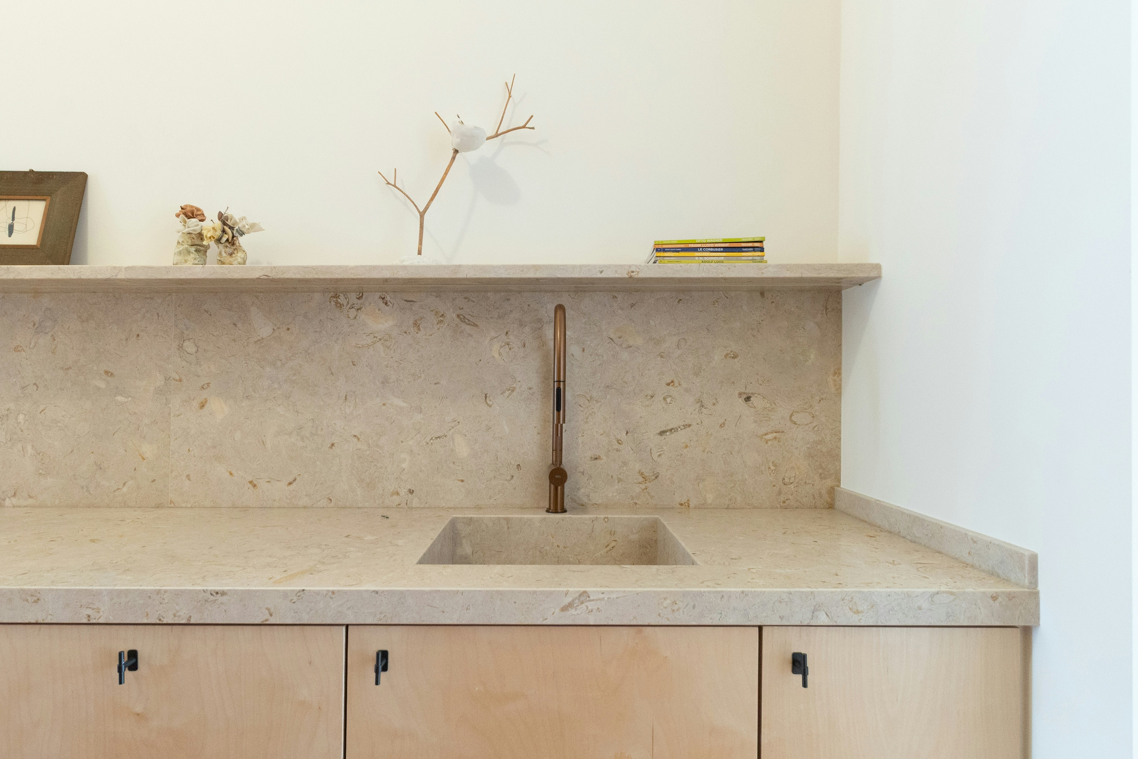 A modern bathroom sink and counter are featured.
