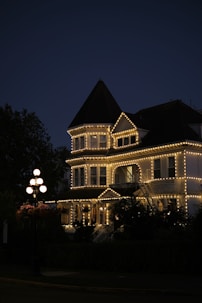 House adorned with lights at dusk.