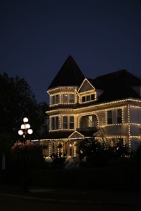 House adorned with lights at dusk.
