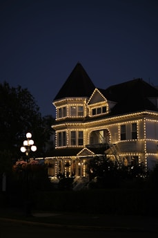 House adorned with lights at dusk.