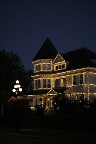 House adorned with lights at dusk.