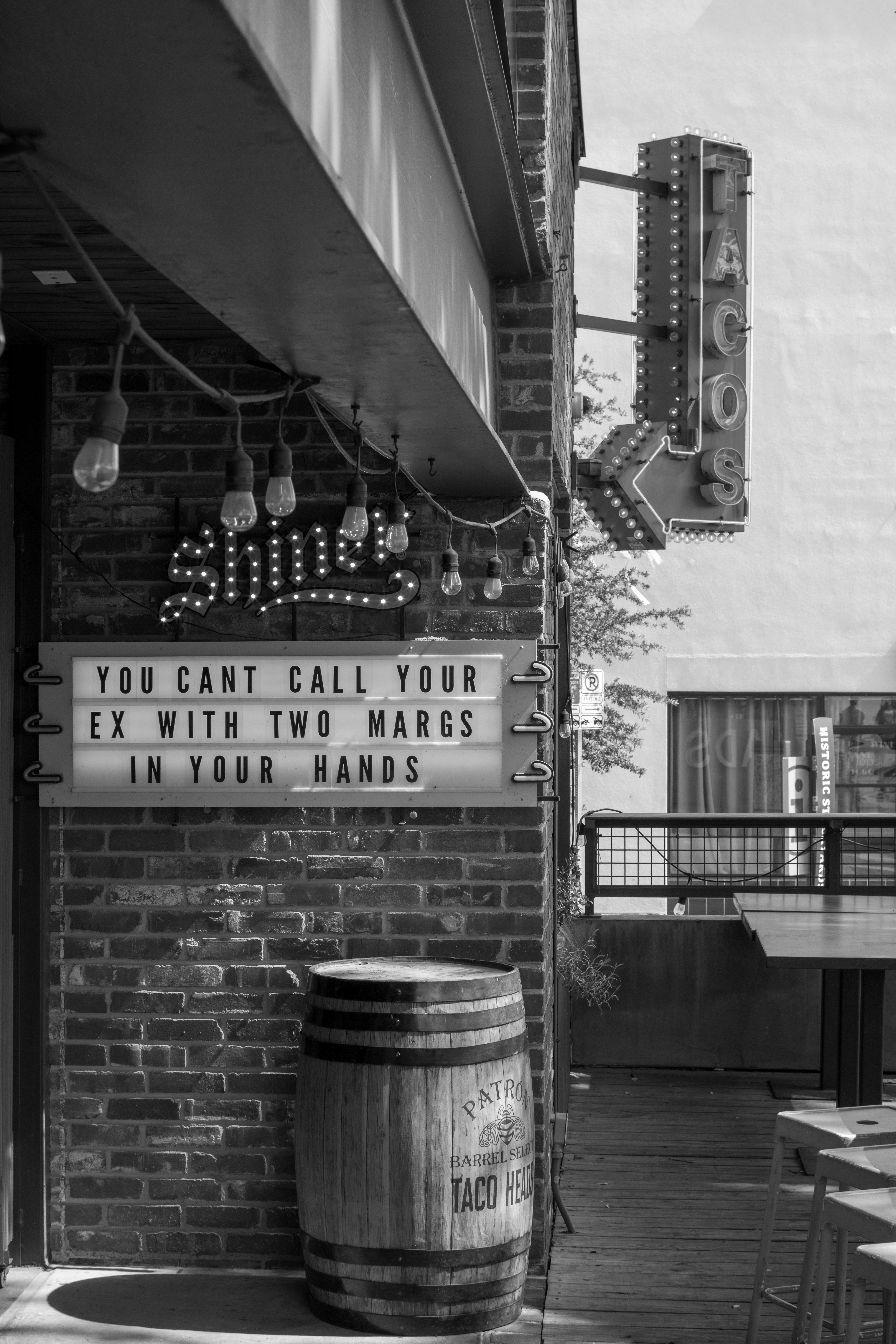 Restaurant entrance with a fun, witty sign.