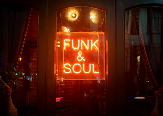 Neon sign announces "funk & soul".