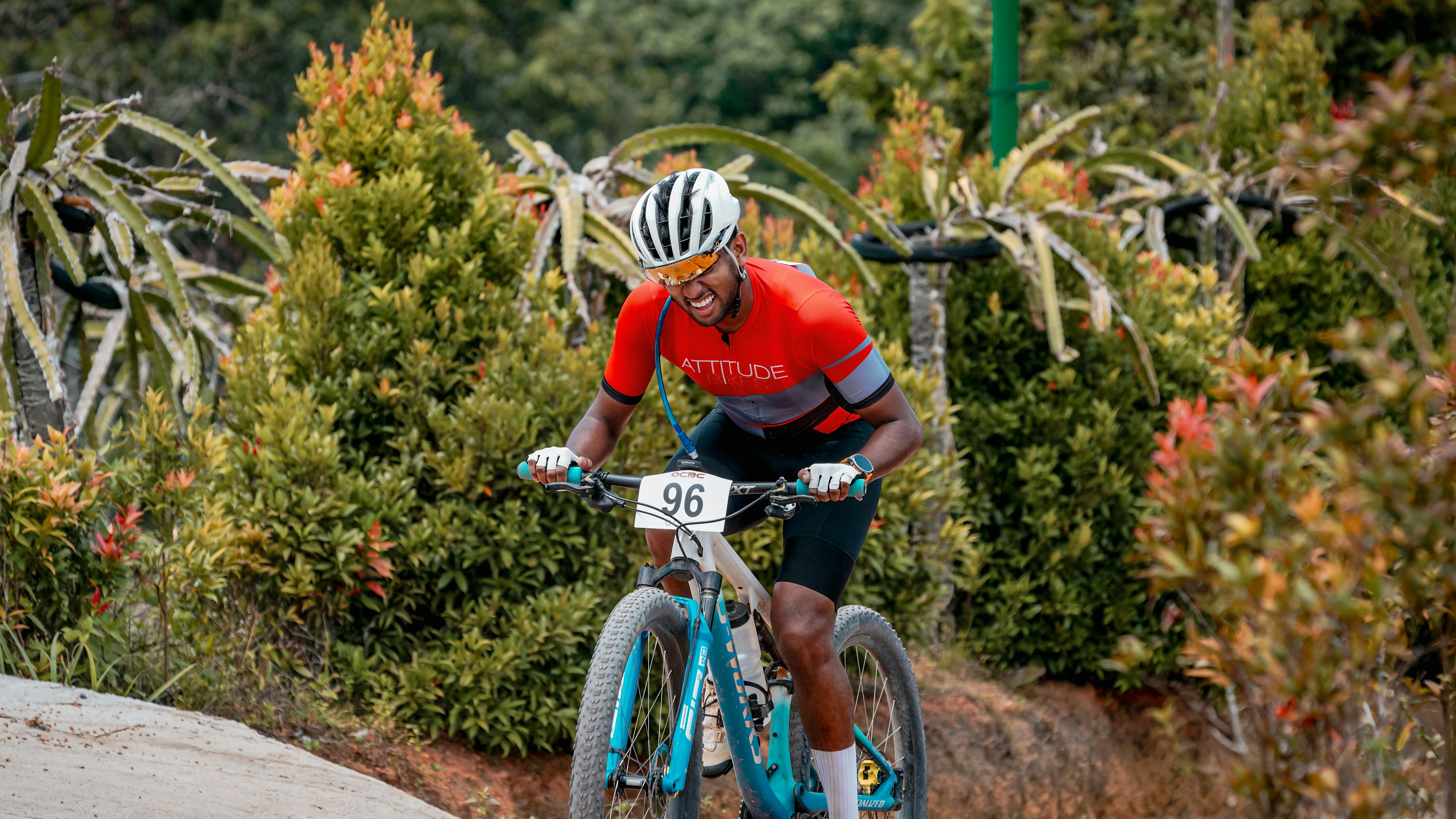 A cyclist rides a mountain bike.