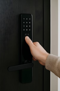 A fingerprint unlocks a digital door lock.