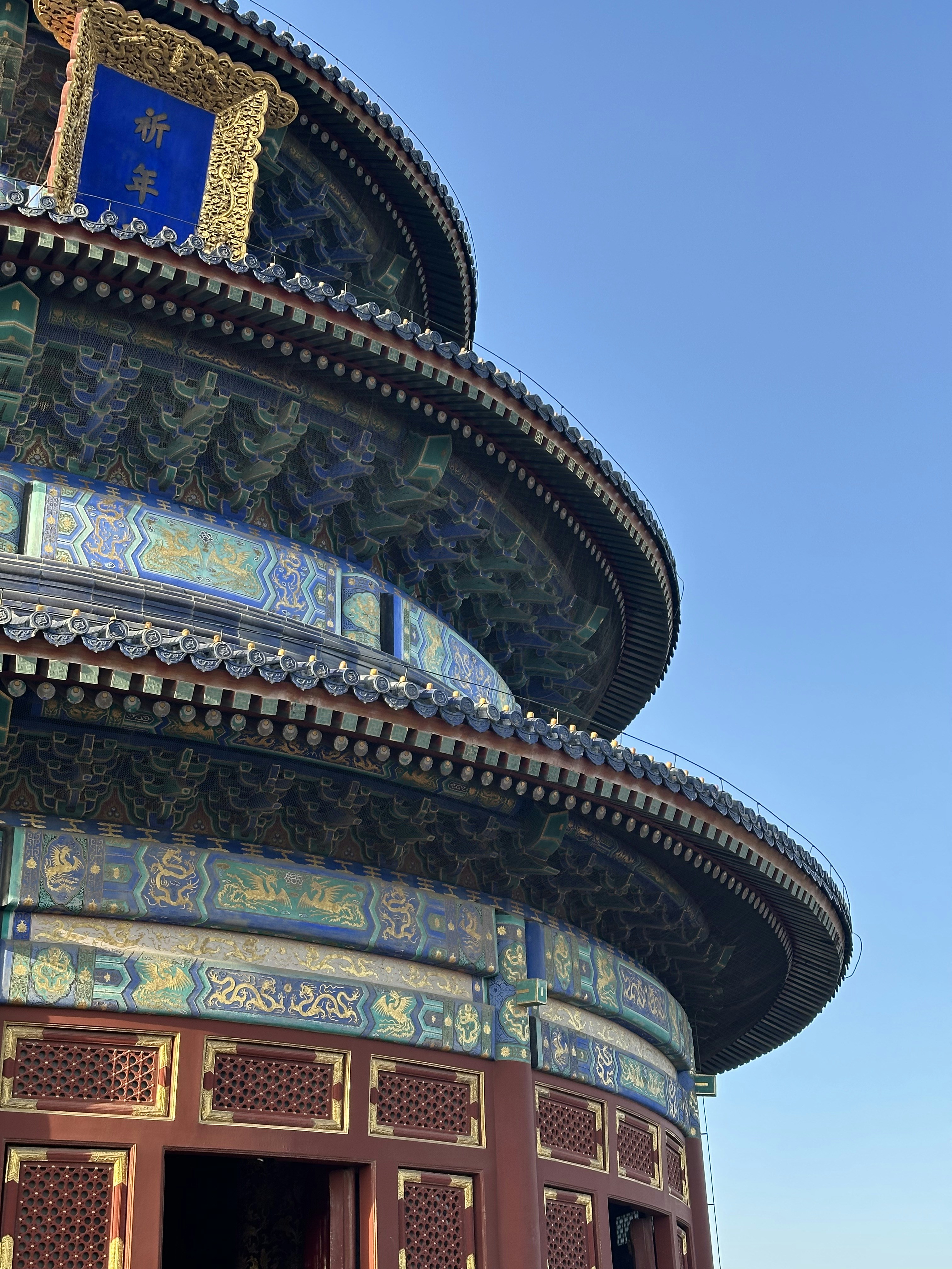 A colorful temple with a blue sky as background.