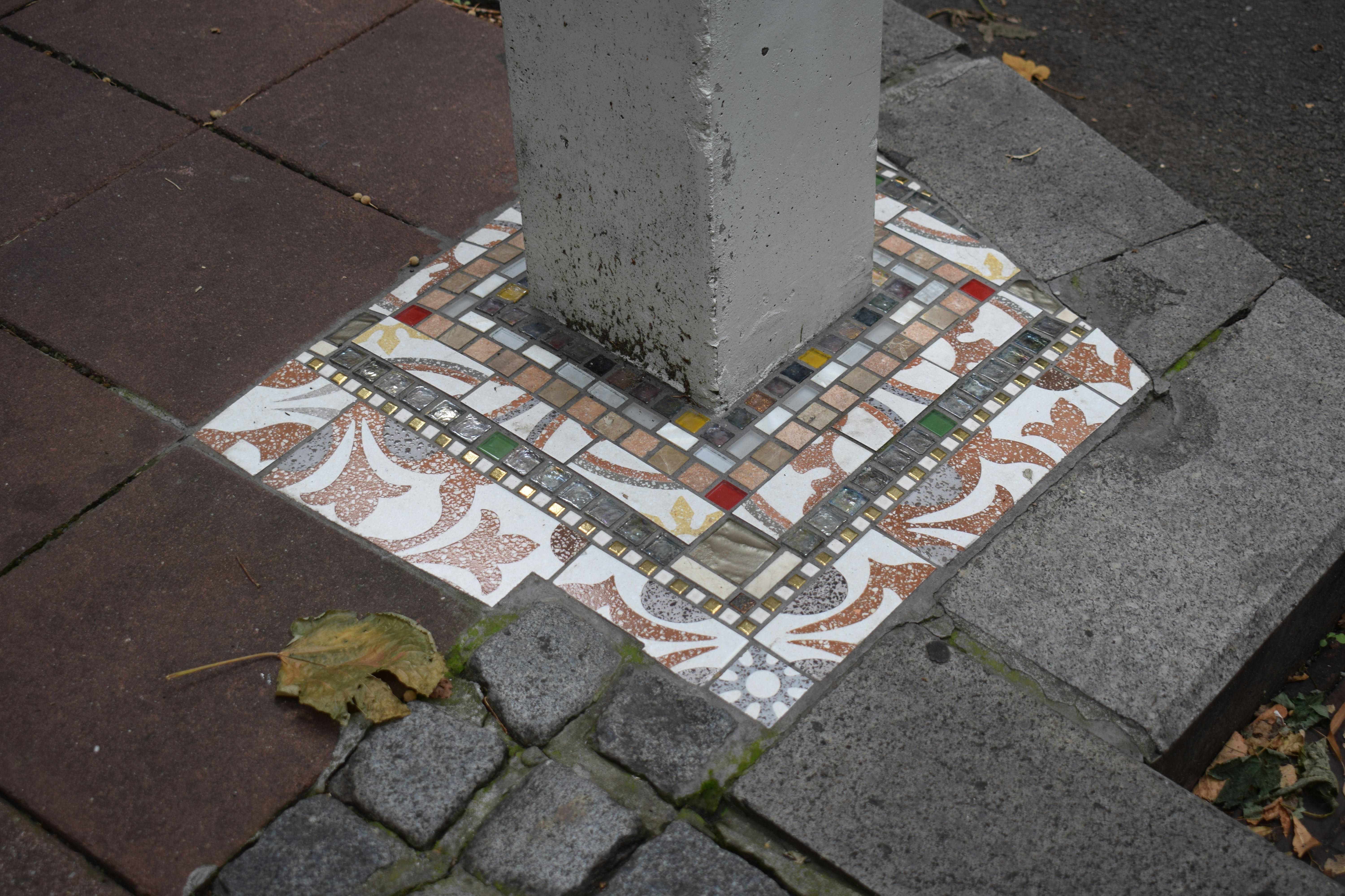 A person installing tiles on a floor