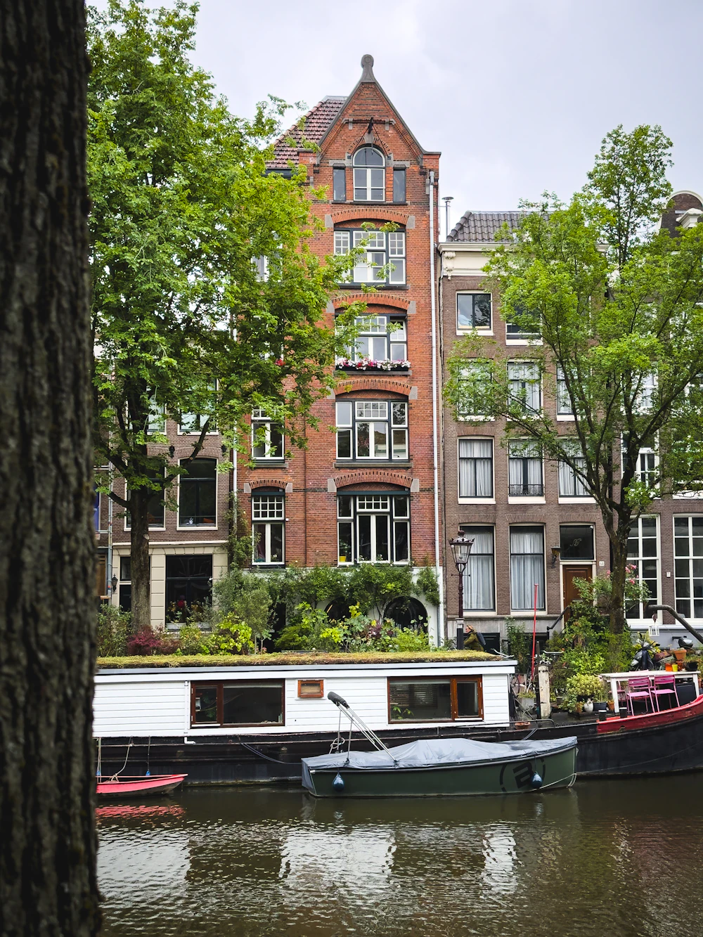 Traditional canal houses beside the water in Amsterdam, Netherlands