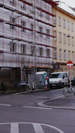 Building under renovation with scaffolding visible.