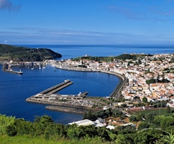 A beautiful coastal town sits by the ocean.