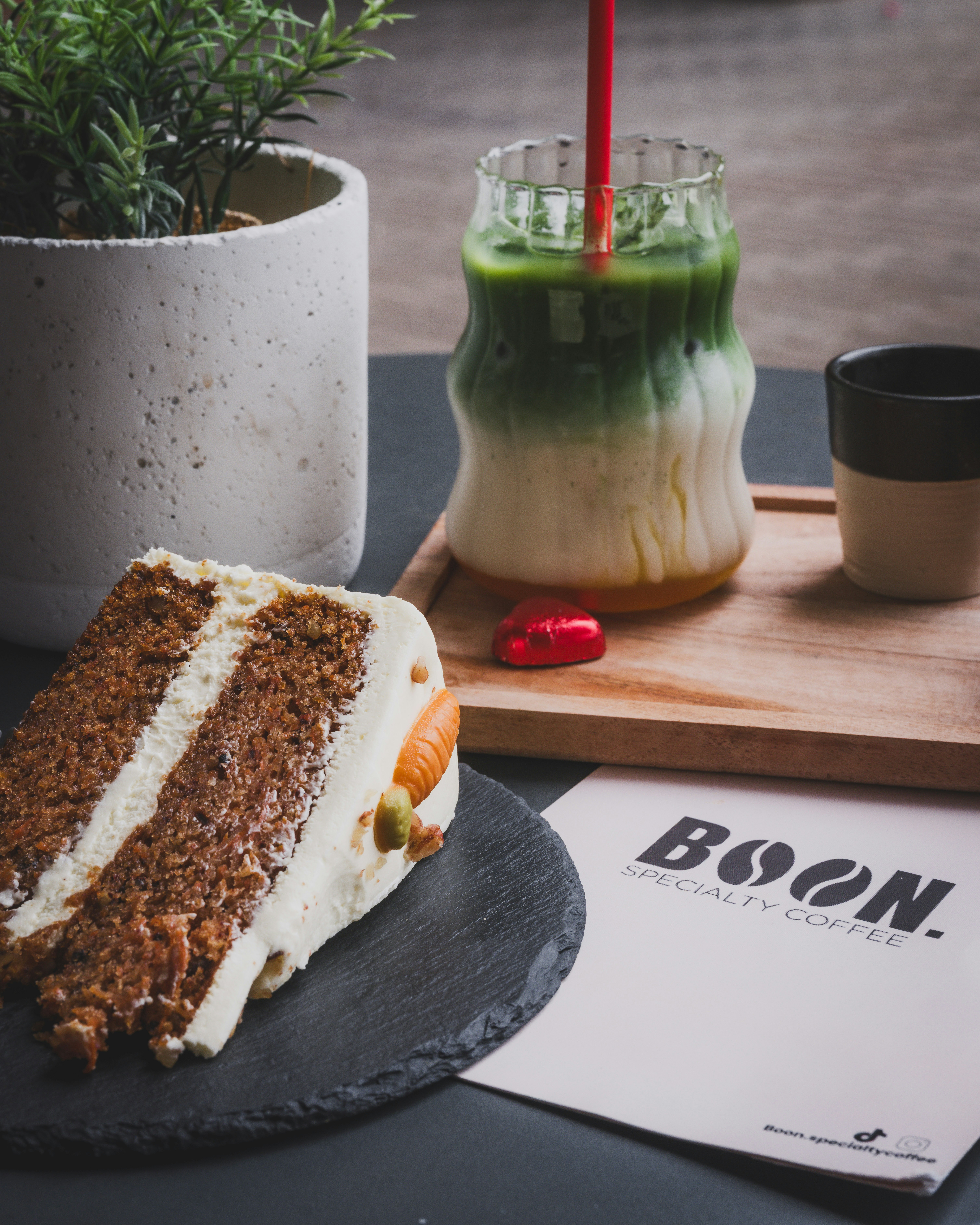 Cake, matcha latte, and coffee; a cafe experience.