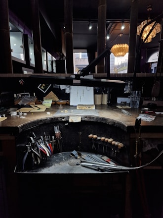 A jeweler's workspace with tools and supplies.