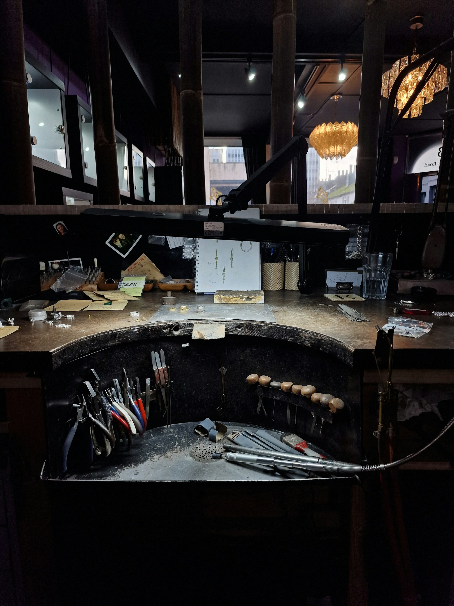 A jeweler's workspace with tools and supplies.