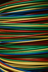 Colorful wires are stacked together in a bundle.
