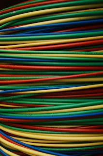 Colorful wires are stacked together in a bundle.