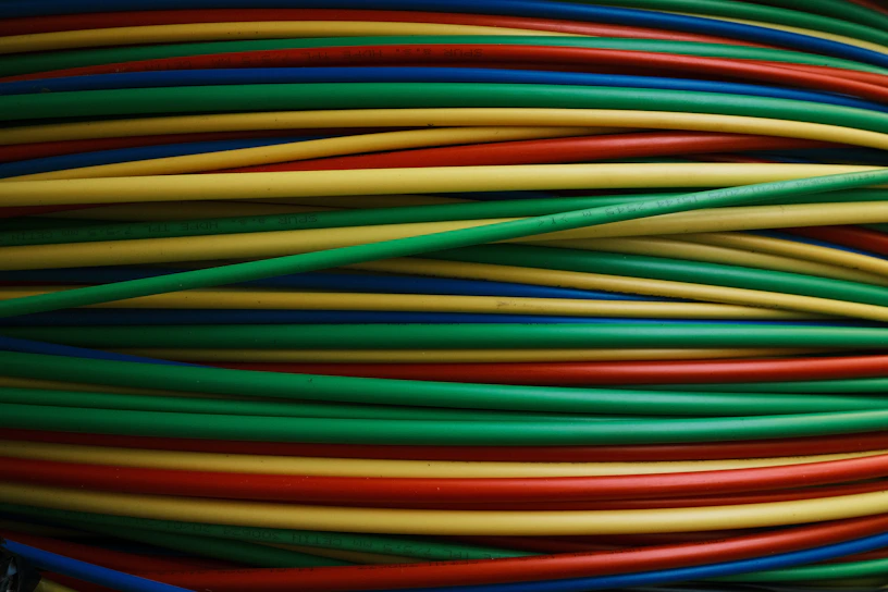 Colorful wires are bundled together, side by side.
